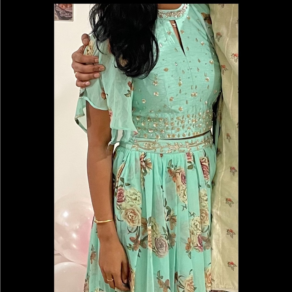 Ethinic Indian Floral Lehenga.Wore only once and it is very pretty color.